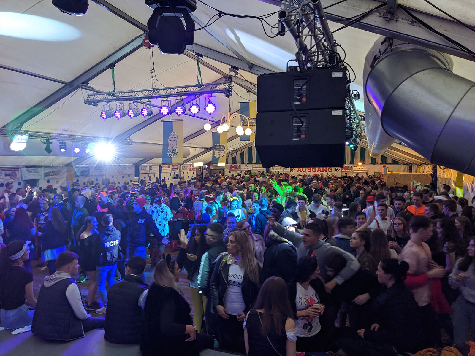 Speakers flown from the tent roof above the crowd